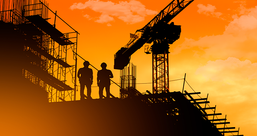 Construction workers sunset