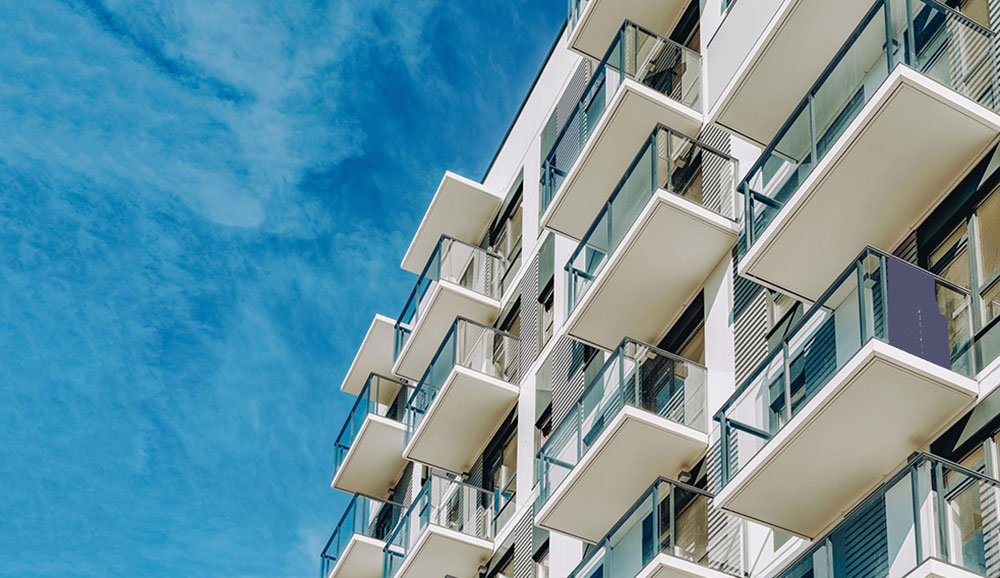 Apartment Building Blue Skies